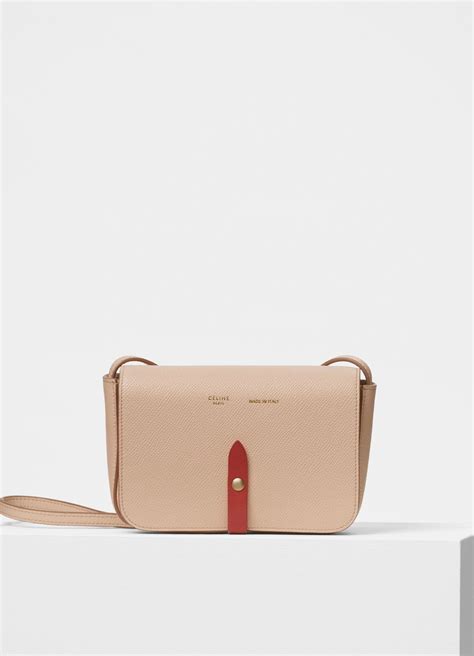 Strap clutch in grained calfskin and shiny calfskin 